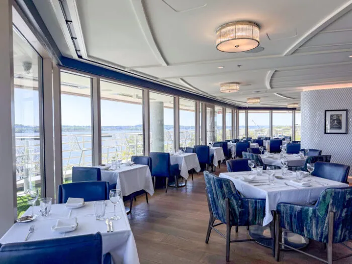 Elegant dining room with waterfront views at Jula's restaurant