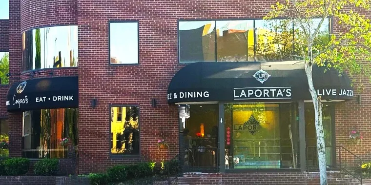 Striped front and side awning of Laporta's Restaurant storefront
