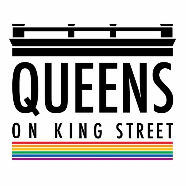 Bold black text reads QUEENS ON KING STREET below a stylized crown and above six horizontal rainbow stripes, representing LGBTQ+ pride. The design uses a clean, modern font on a white background.