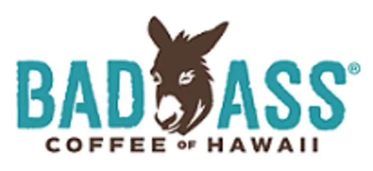 Logo for Bad Ass Coffee of Hawaii featuring the word BADASS with a donkeys face forming the A, and COFFEE OF HAWAII in smaller text below.