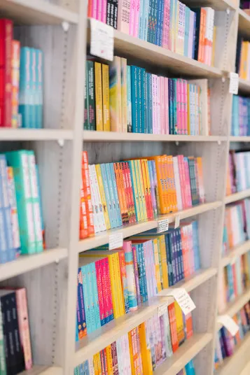 Cozy bookstore interior with shelves of books and warm lighting