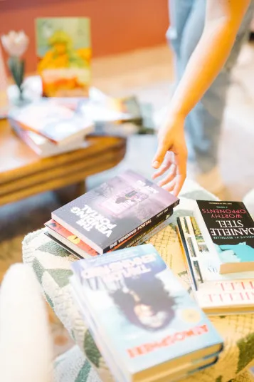 Friends to Lovers Bookstore storefront display with books and window signage