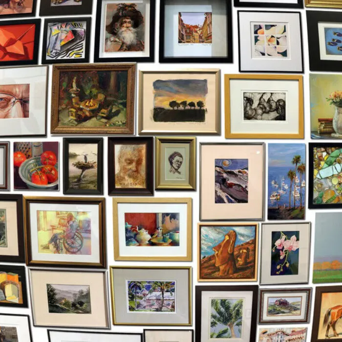 A gallery wall filled with various framed artworks, including portraits, landscapes, still lifes, and abstract pieces, all arranged closely together in different sizes and styles.