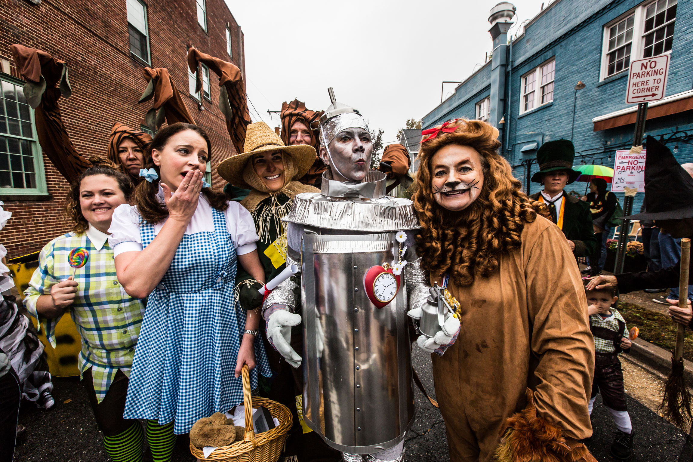 A group of people dressed in costumes as various characters from the Wizard of Oz.