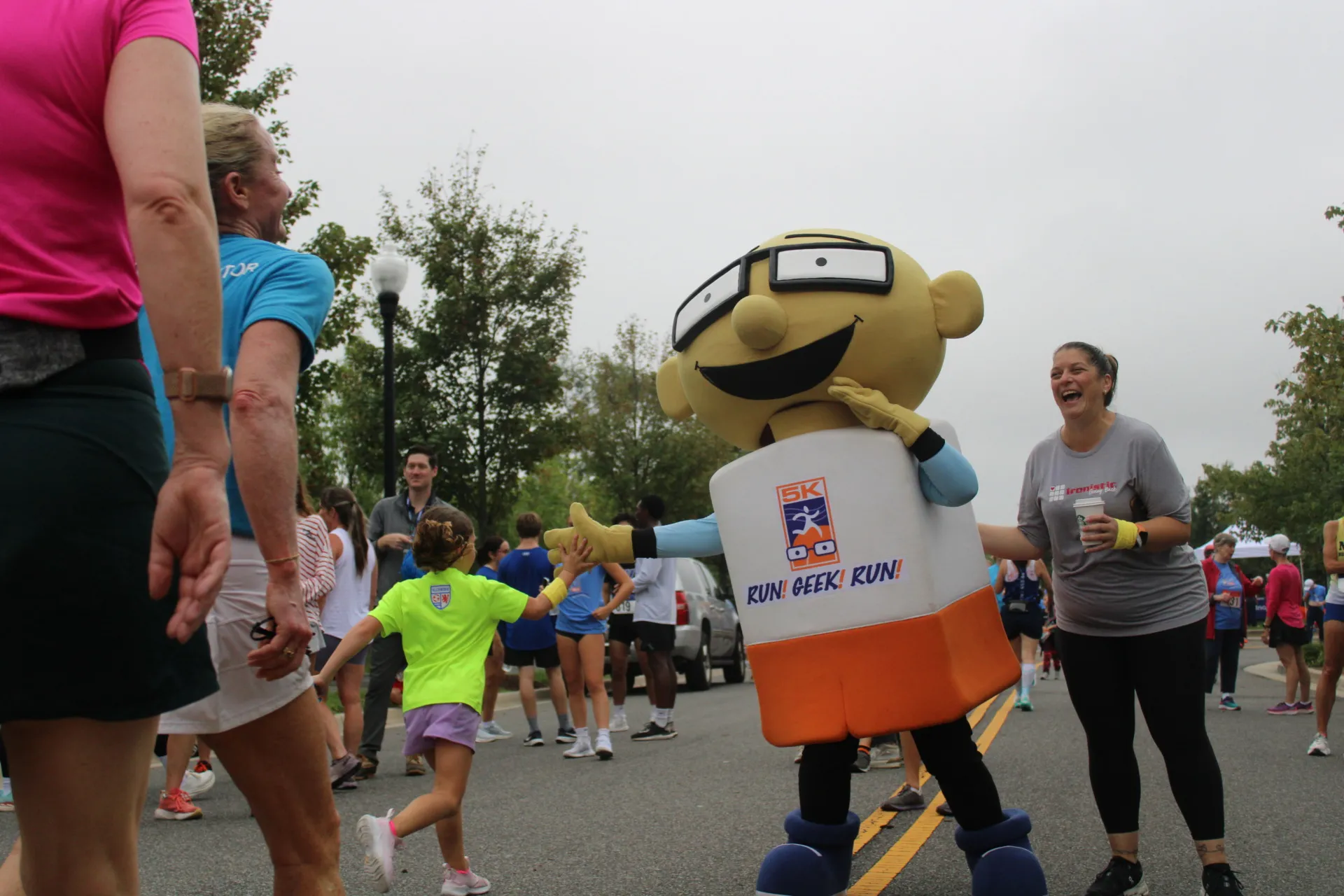 Runner high-fiving spectator at RUN! GEEK! RUN! race event