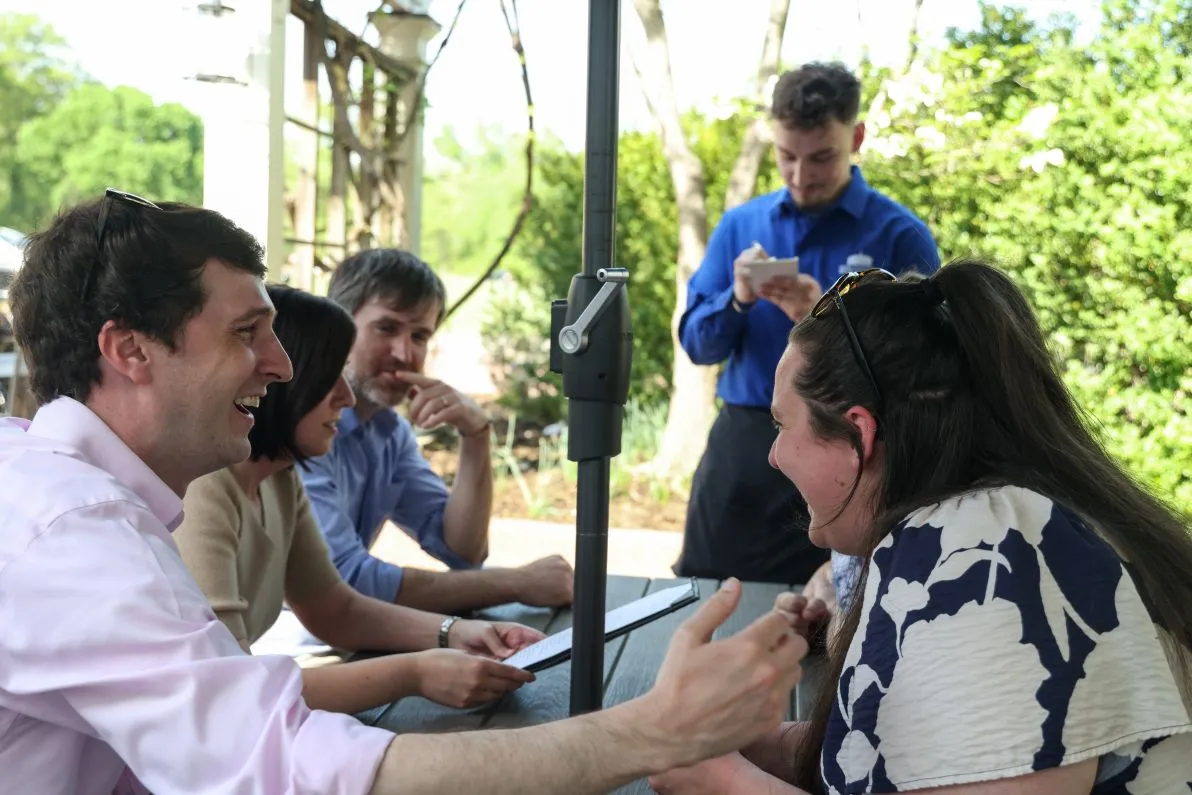 Customers laughing and talking at the Beer Garden at Mount Vernon Inn Restaurant.