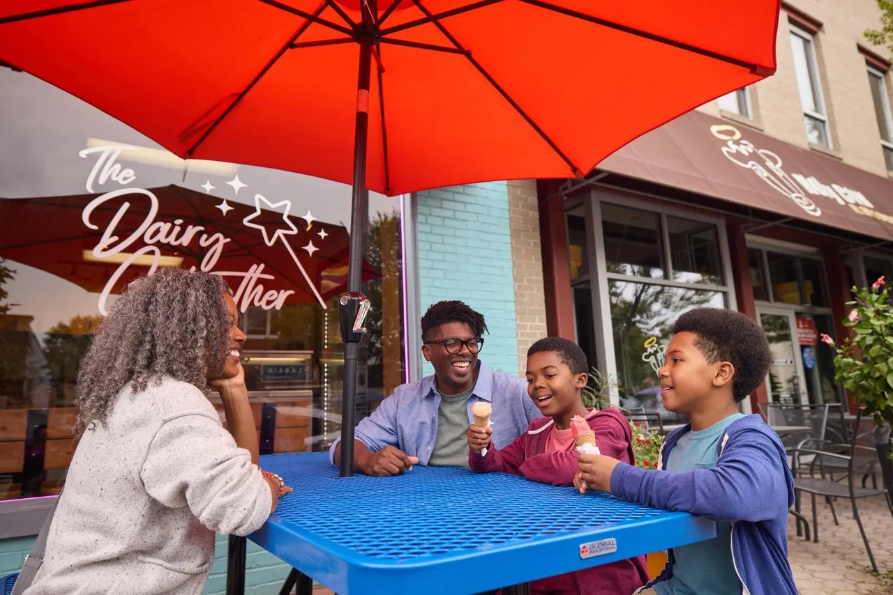 A family enjoys frozen custard at a table outside of Dairy Godmother in Alexandria's Del Ray neighborhood.