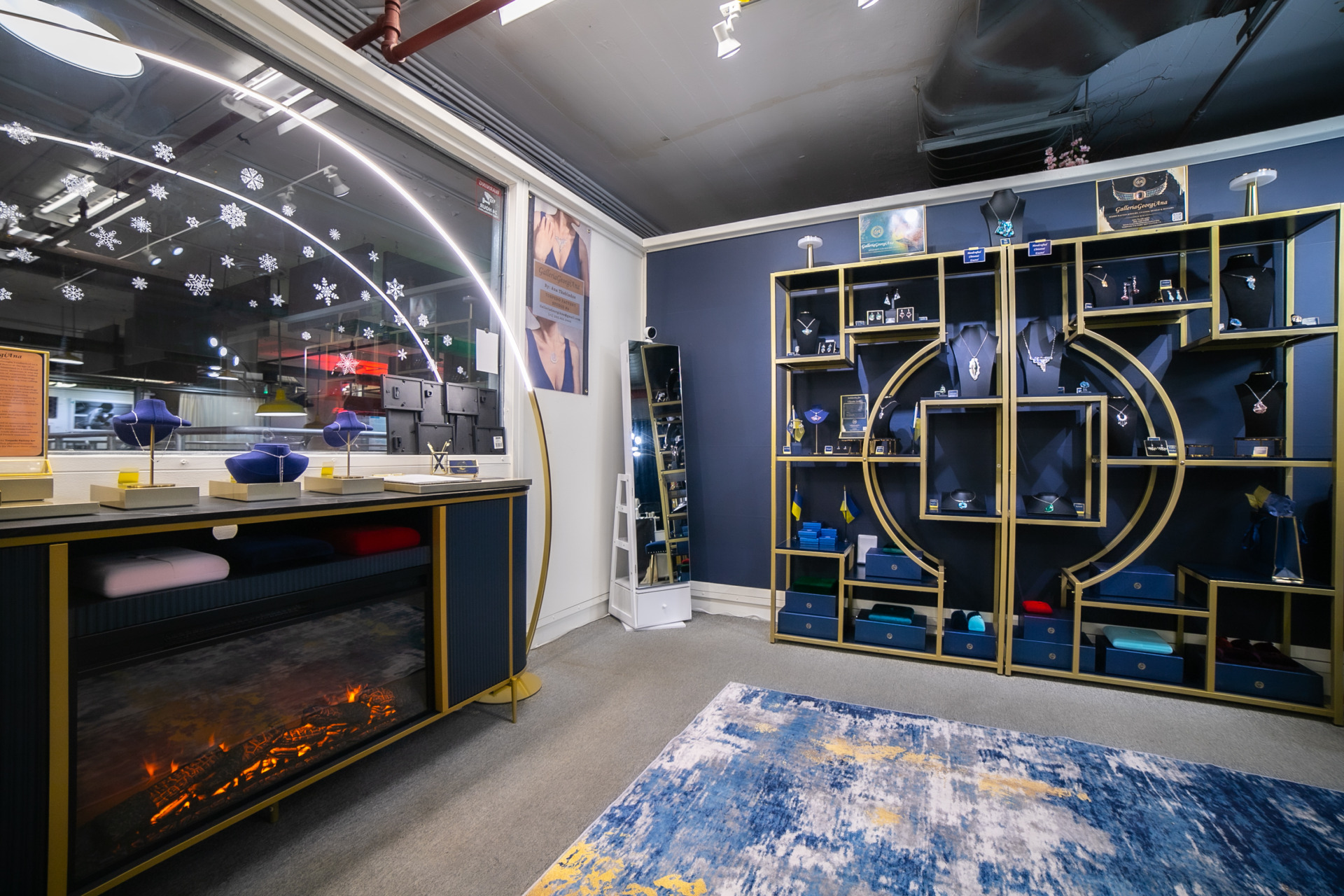 A wide angle view of Ana's studio featuring jewelry displays and elegant decor. 