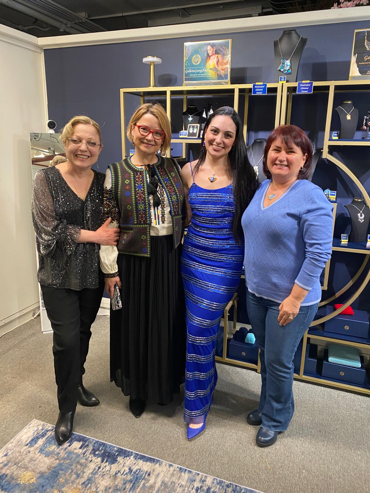 Ana posed with guests at her studio's grand opening party. 