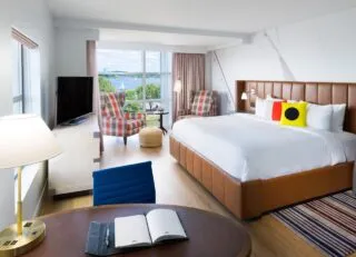 The interior of a room at Hotel Indigo in Alexandria, VA overlooking the Potomac River.