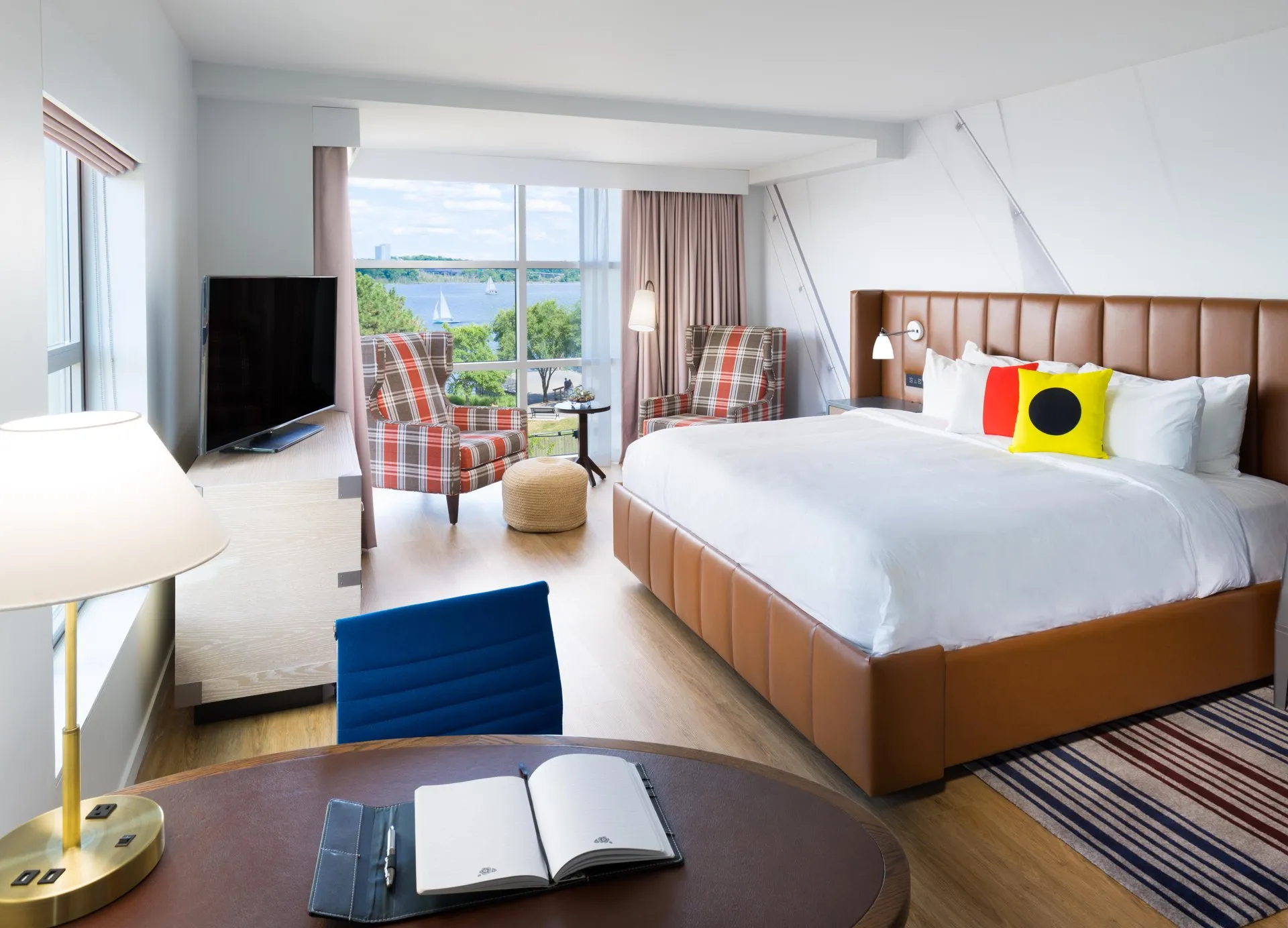 The interior of a room at Hotel Indigo in Alexandria, VA overlooking the Potomac River.