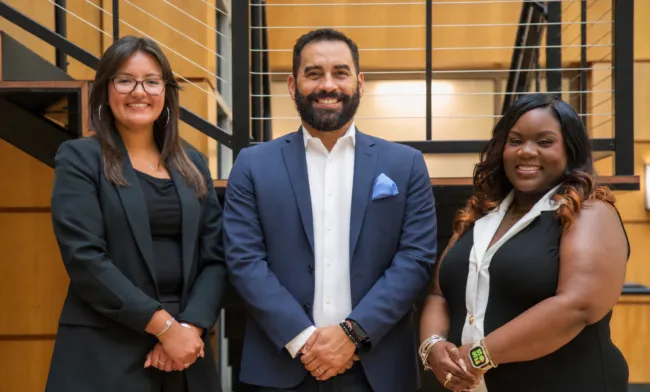 Visit Alexandria's Sales Team standing together. Starting from the left is Gabriella Garcia, Juan Carlos Rivera, and Sha'Niesha Graham